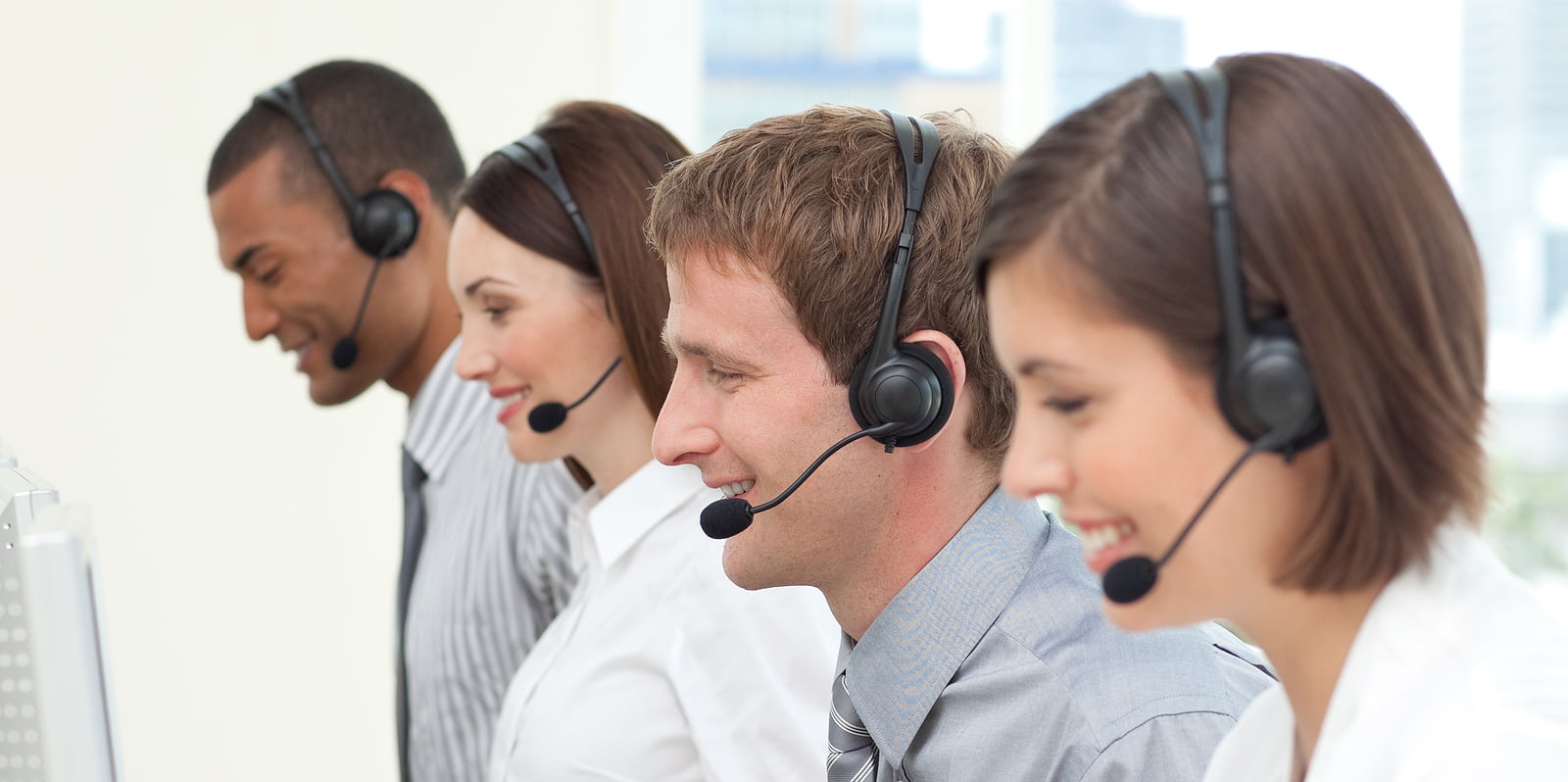 Co-workers with headset on In A Call Center