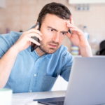 Worried man calling call center having problem with client support