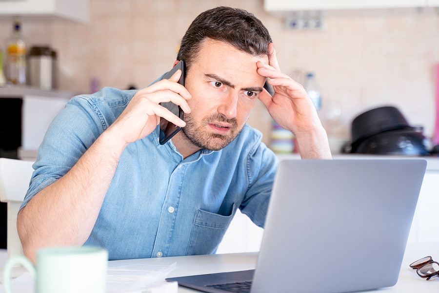 Worried man calling call center having problem with client support