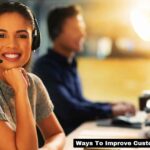 Woman employee in call center smiling